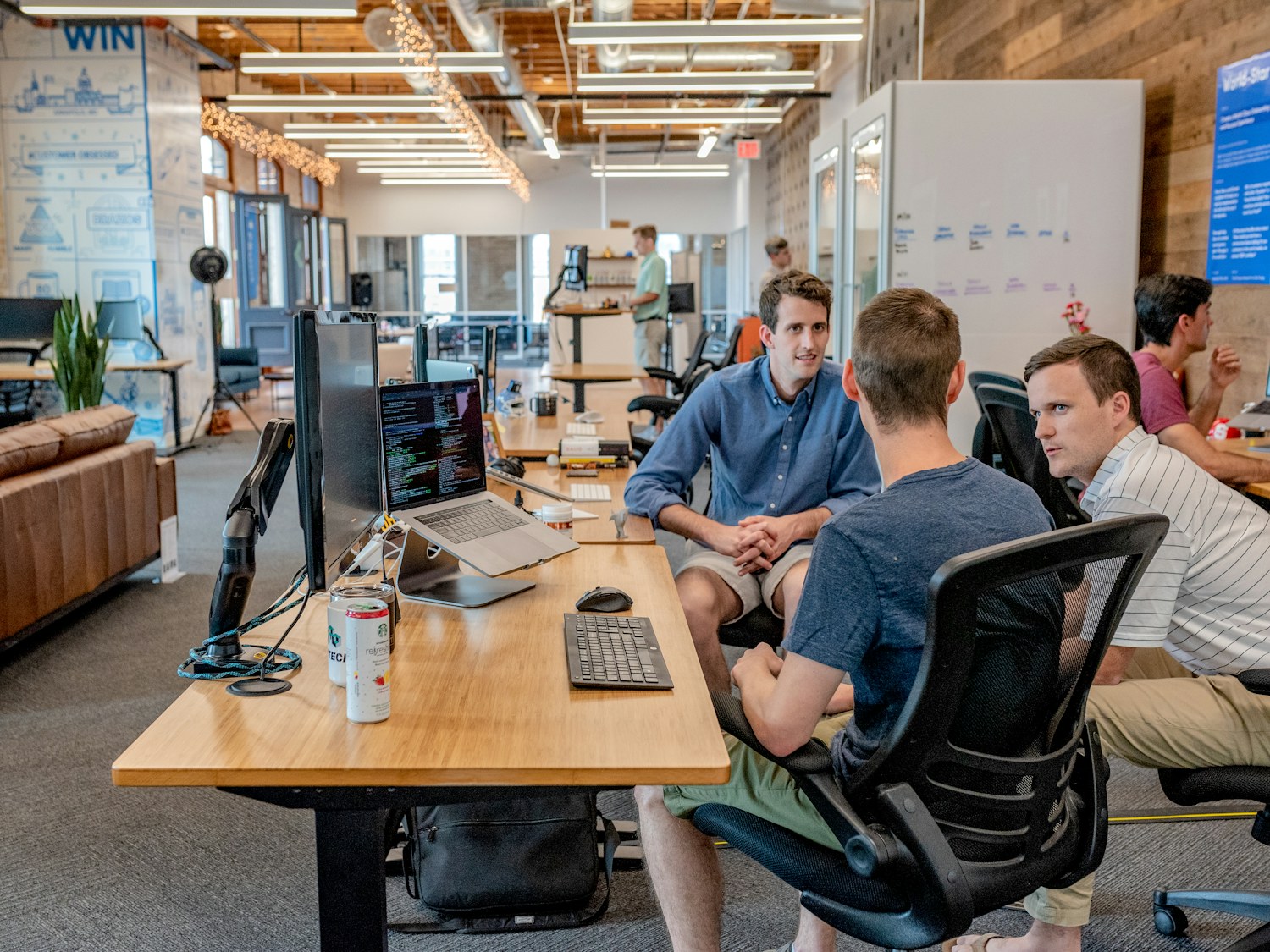 Colleagues in discussion at a modern workplace