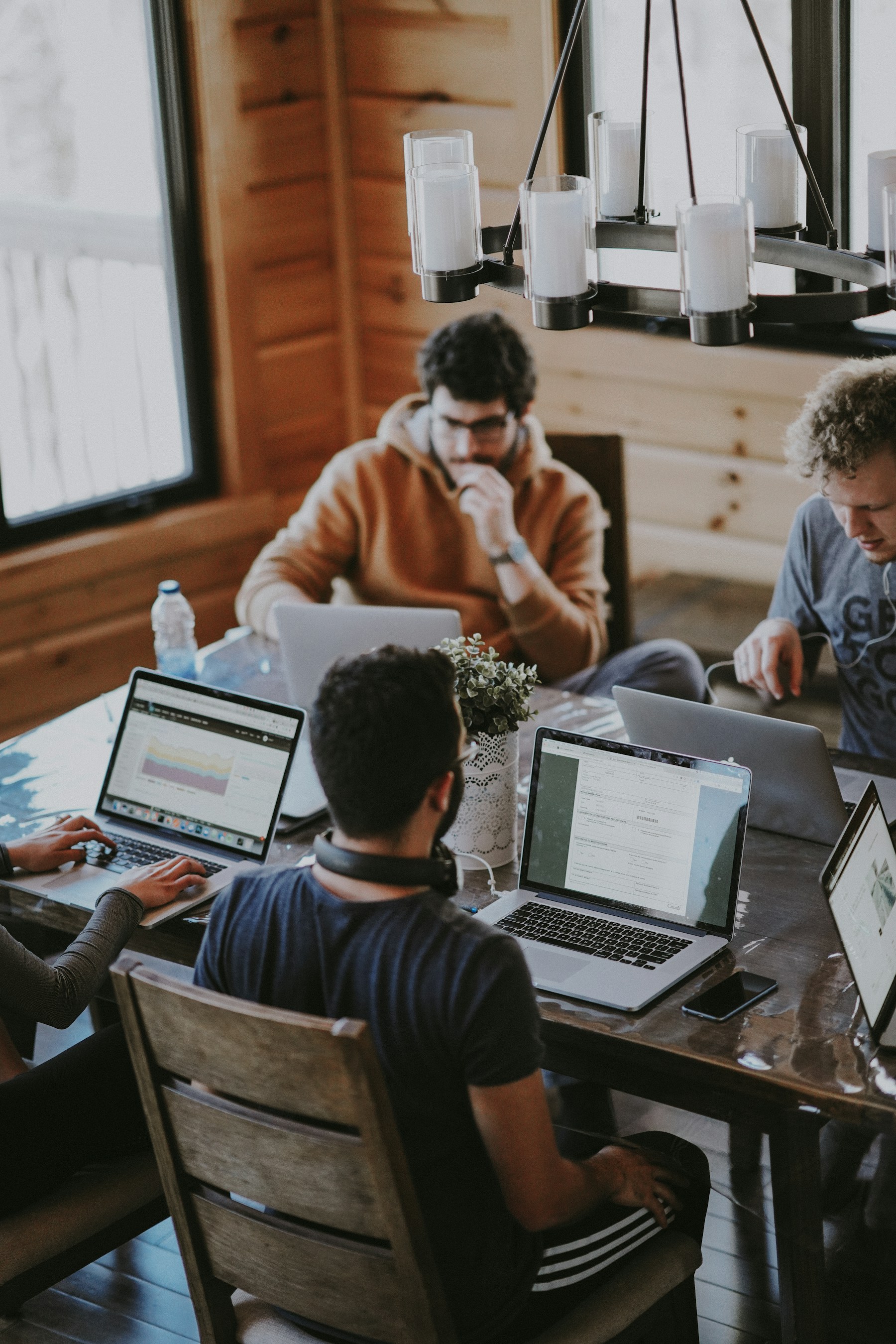 People collaborating around a table in a contemporary business setting